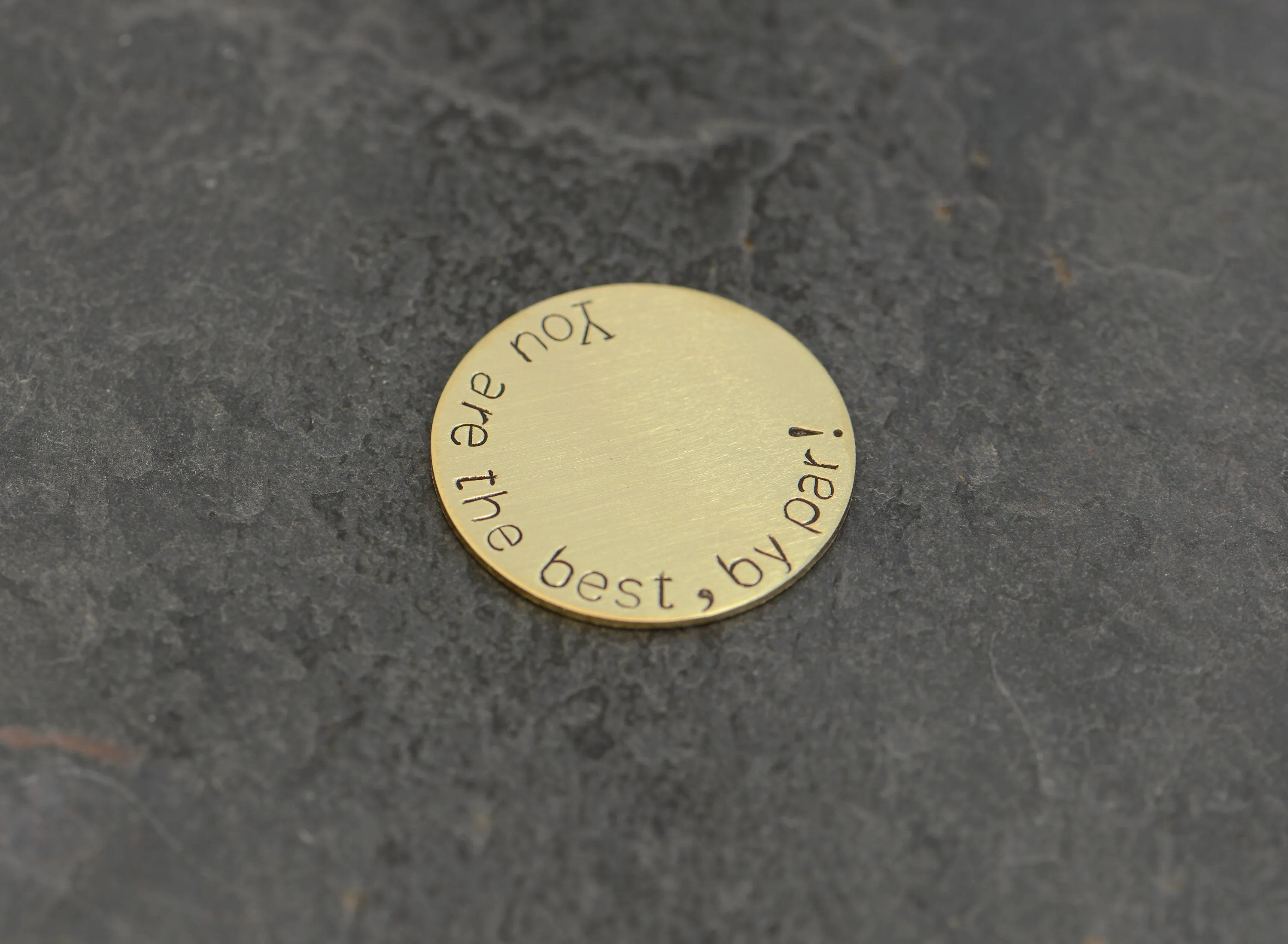 Bronze golf ball marker stamped with you are the best by par