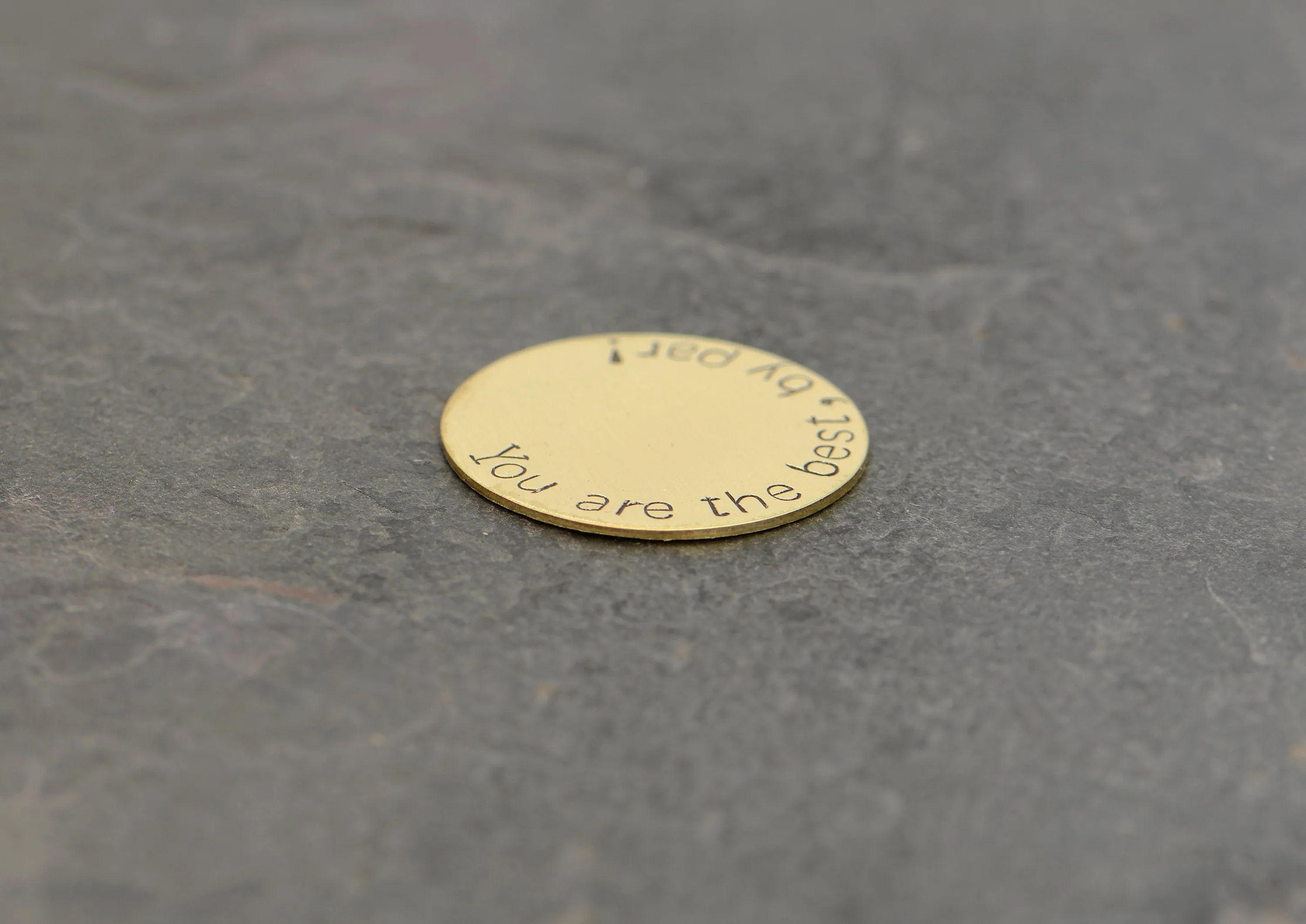 Bronze golf ball marker stamped with you are the best by par