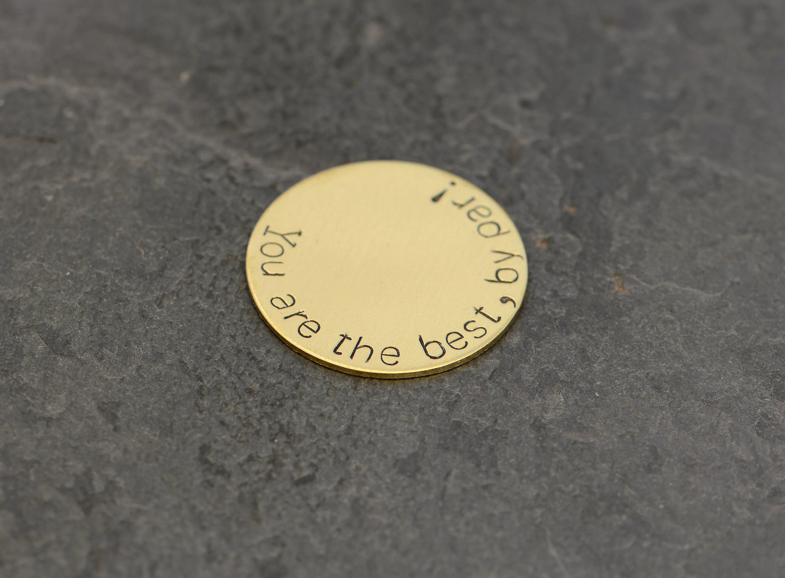 Bronze golf ball marker stamped with you are the best by par