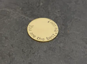 Bronze golf ball marker stamped with you are the best by par