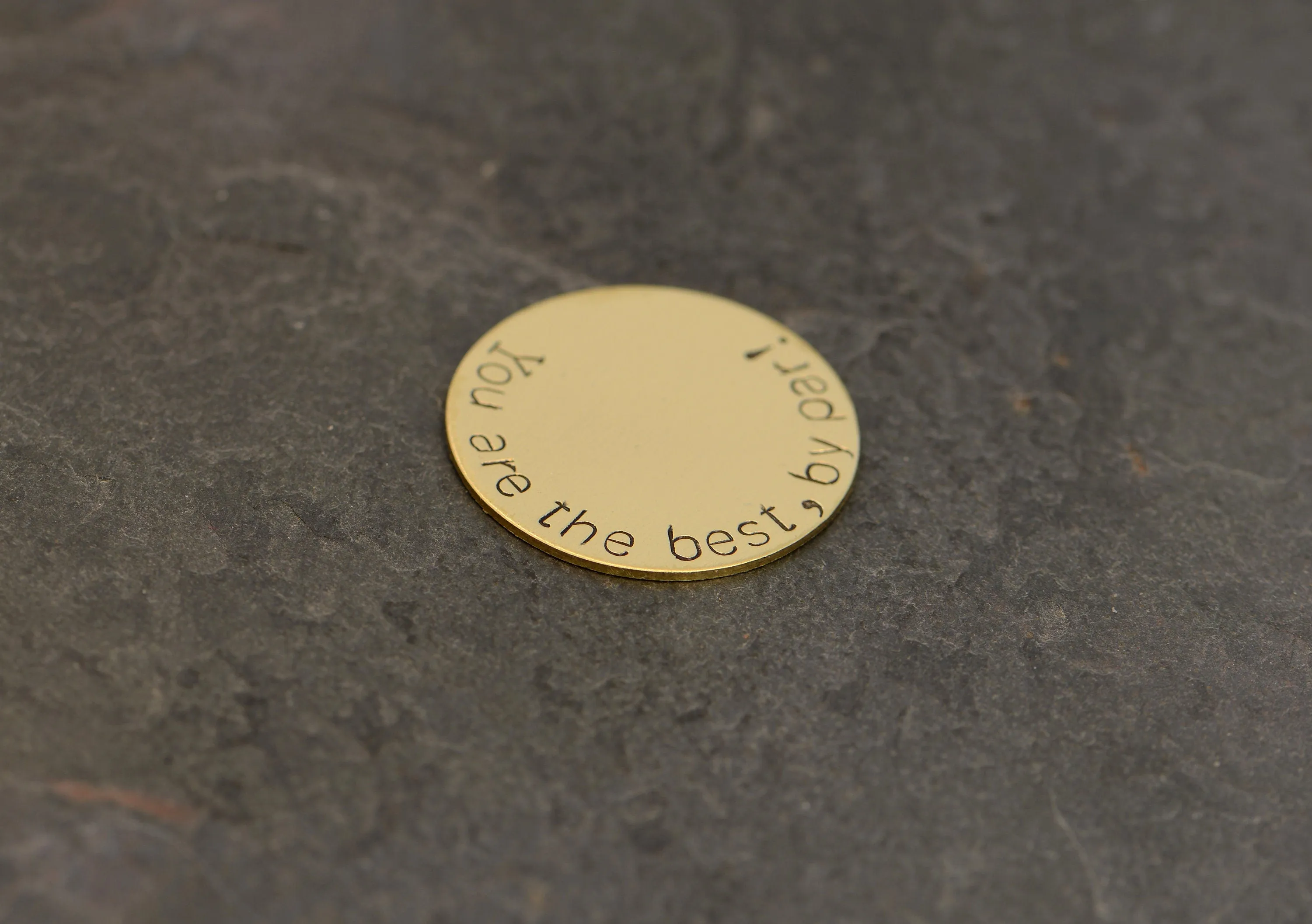 Bronze golf ball marker stamped with you are the best by par
